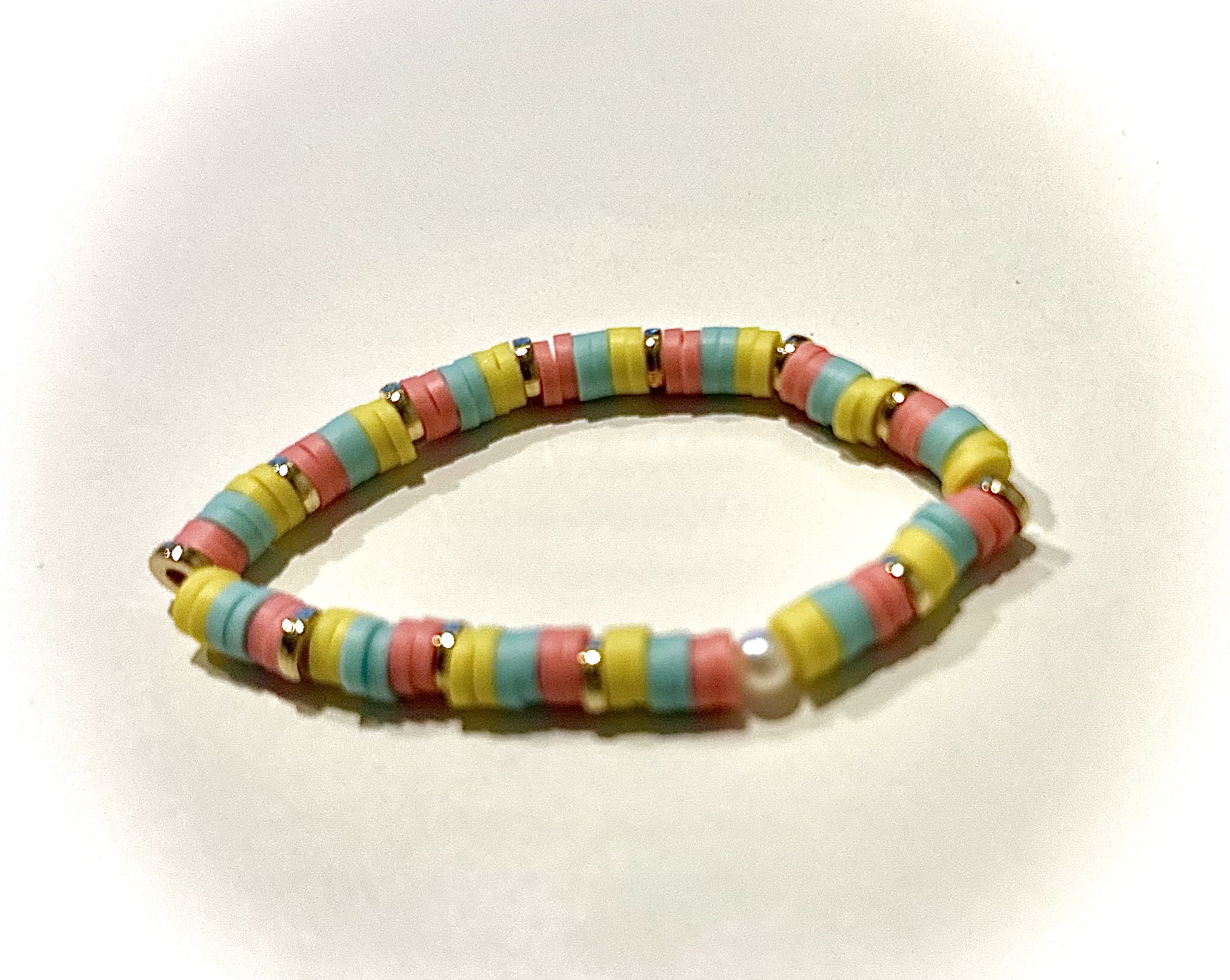 Sunset Shell bracelet with colorful disc beads and gold shell charm